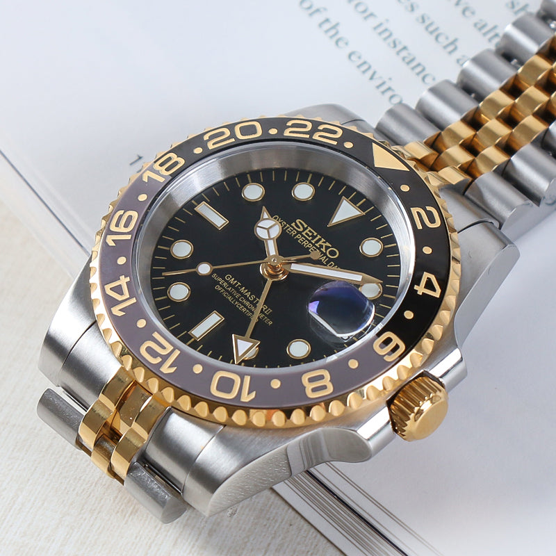 Traveler GMT Automático – Black Gold Steel Jubilee NH34