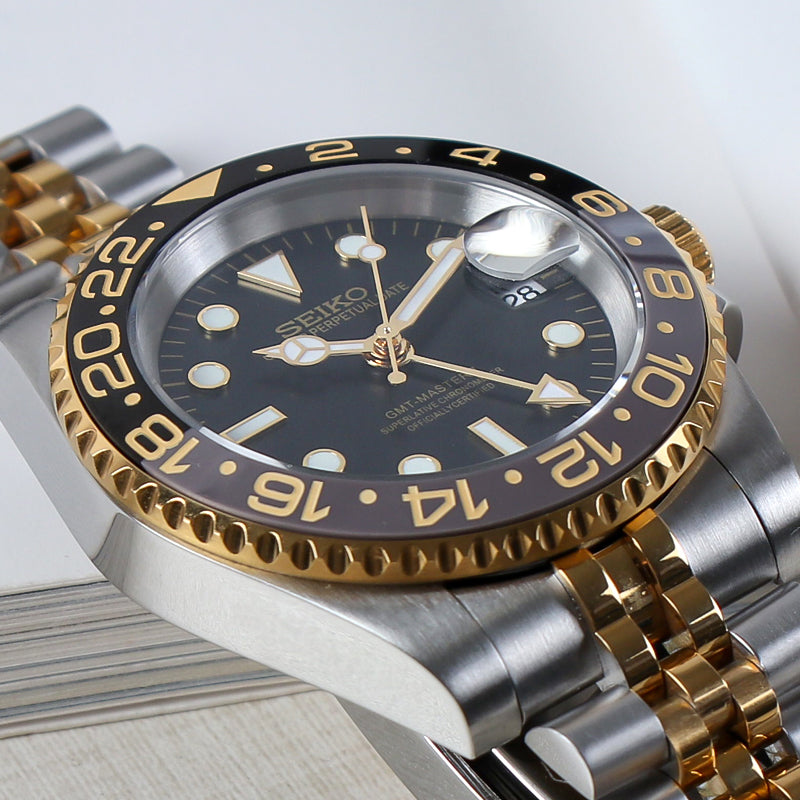 Traveler GMT Automático – Black Gold Steel Jubilee NH34